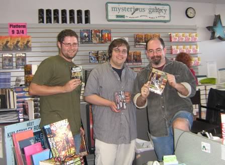Photobucket]</a></div> </p><p>The Mysterious Galaxy Crew, holding up Elantris, Mistborn, and Alcatraz, all of which were written by Brandon Sanderson.</p><p> </p><p>Questions and Answers:</p><p>Q: (Our first question was the obligatory) â€œWho killed Asmodean?â€</p><p>A: The answer will be in one of these three books.</p><p> </p><p>Q: What character is easiest for you to write?  Which is most difficult?</p><p>The Two Rivers folk were the easiest (Rand, Perrin, Mat, Egwene, and Nynaeve).  Aviendha was the most difficult.  She thinks more like an Aiel than most Aiel.  But he was glad to bring her back to the forefront because he had always liked the way she thought.  Tuon was not easy either.</p><p> </p><p>Q: Is there a connection between the spoilage of food and Randâ€™s temperament?</p><p>A: Look at the Fisher King prophecies, and the prophecies in WoT that mention that the â€œland and the Dragon are one.â€</p><p> </p><p>Q: What is your favorite scene that you got to add?</p><p>A: Iâ€™m not saying which scenes I added and which parts are Jordanâ€™s until all three books are out.  He has lots and lots of notes left by Robert Jordan, which arenâ€™t organized.  No one really knew how Robert Jordan was organizing his work.  Some files had only sentences, some whole paragraphs and whole scenes.  His assistants, Maria and others, what Brandon calls â€œhis own personal Brown Ajahâ€ started asking Robert Jordan questions about all of the chacters, where they would end up and how they got there.  So Brandon has so much information all jumbled together without any order.  And its his job to take all that and make a book.</p><p> </p><p>Q: What mythâ€™s influences Robert Jordan the most?</p><p>A: Native American and Norse mythology are featured prominently, but there are obvious influences from the Fisher King and Grail legends.  Brandon also mentioned that Odin and Loki were thought to have originally been one person in the early myths, but was split into two.  He noted that Odin had a spear and that Loki was pictured with Ravens.  Also, Brandon would sometimes ask Harriet about a particular passage and ask where Jordan got his inspiration.  Harriet would pull out a book of myth, turn to a page and point it out.</p><p> </p><p>Q: What is Robert Jordanâ€™s office like?</p><p>A: He worked on the first floor of a carriage house, the first room was a big library and the second was like a â€œwizards workshop.â€ The Brown Aes Sedai whose quarters he describes in The Gathering Storm, with skeletons everywhere, was basically a description of Robert Jordanâ€™s office.  He had skeletons everywhere, and weapons (though the weapons were left out of the Aes Sedaiâ€™s room).</p><p> </p><p>Q: Was the passage about Cadsuane spanking Semirhage already written, or was there just information in the notes.  How did you feel about writing that section?</p><p>A: He was given creative freedom to do what was needed.  No author can ever stick 100% to an outline, things change as they are being written, and he was given that kind of control in order to make the books work.  Regarding that passage in particular, it made Brandon Sanderson cringe, but Robert Jordan wanted it in the books so it stayed.</p><p> </p><p>Q: When are books 13 and 14 due out?</p><p>A: He is three-fourths of the way through Towers of Midnight, and he expects to turn that in in January.   He hasnâ€™t been able to write as much as he had hoped during this 26 city tour, so that is putting him back a bit, but he is still confident he can get it in close to on time.  It took him 16 months to write The Gathering Storm, and some of that writing ended up being allocated to Towers of Midnight.  He expects it to be published in the fall of 2010, or at the latest March of 2011.</p><p> </p><p>Q: Did the ending of the Wheel of Time shock you?</p><p>A: No, it â€œsatisfied me.â€  There were â€œshocking thing in the notes, such as â€˜Egweneâ€™s unexpected visitorâ€™â€ but on the whole the ending was satisfying.â€</p><p> </p><p>Q: Were you surprised to learn who Asmodeanâ€™s killer was?</p><p>A: No, not really.  He had read every theory out there, and there is basically a theory for every character.  One of those theories is right (he wont say which of course!), so since he had already read the theory it wasnâ€™t a surprise just a â€œah, so it was that person.â€</p><p> </p><p>Q: When will we see Way of Kings?</p><p>A: Iâ€™ll be posting more about it in 2010, this year is for WoT.  He expects it to be available around September 2010.</p></div></body></html>